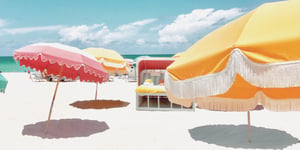 brightly colored umbrellas on sandy beach