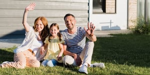 family-in-front-of-new-home