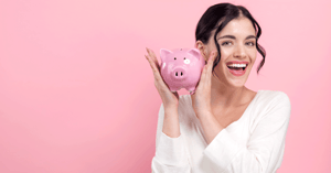 happy-young-person-with-pink-piggy-bank