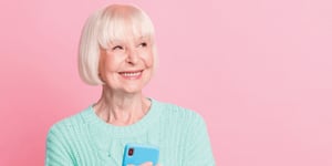 happy older person with phone