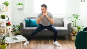 man-working-out-in-living-room