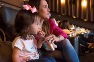 Mother and daughter at a movie theater